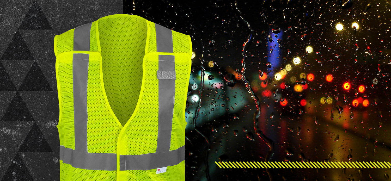 Neon yellow reflective safety vest with silver tape shown against a rainy night background, highlighting visibility benefits in low-light and hazardous conditions.